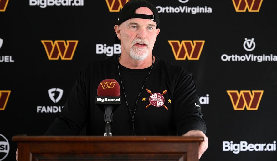 Washington Commanders head coach Dan Quinn speaks to the media before a joint practice with the Miami Dolphins at NFL football training camp, Wednesday, Aug. 12, 2026 in Ashburn, Va. (AP Photo/Nick Wass)