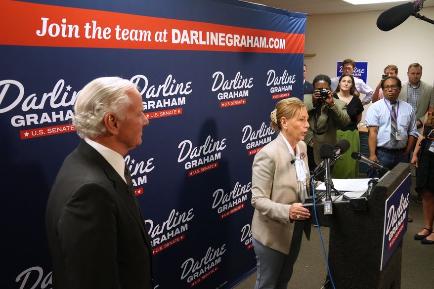 Gov. Henry McMaster, R-S.C., left, looks on as Sen. Darline Graham, R-S.C., speaks at a news conference for her campaign a day ahead of the special GOP Senate runoff to replace her brother, the late Sen. Lindsey Graham, R-S.C., Monday, Aug. 24, 2026, in Columbia, S.C. (AP Photo/Meg Kinnard)