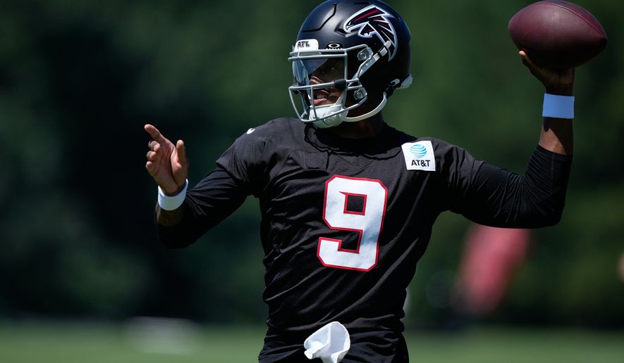 Atlanta Falcons quarterback Michael Penix Jr. (9) runs drills during an NFL football training camp practice Monday, Aug. 24, 2026, in Flowery Branch, Ga. (AP Photo/Brynn Anderson)