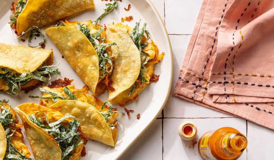 This image released by Voracious shows a recipe for chicken tacos from the cookbook "The Protein Meal Prep Plan" by Cassy Joy Garcia. (Alanna Hale/Voracious via AP)