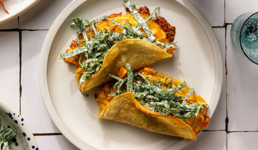 This image released by Voracious shows a recipe for chicken tacos from the cookbook "The Protein Meal Prep Plan" by Cassy Joy Garcia. (Alanna Hale/Voracious via AP)