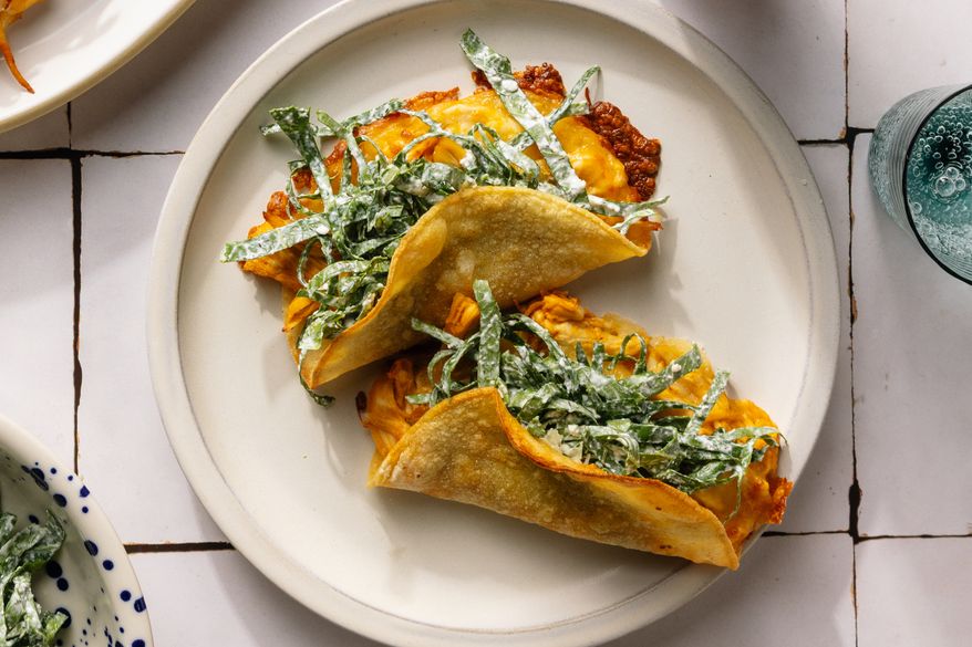 This image released by Voracious shows a recipe for chicken tacos from the cookbook "The Protein Meal Prep Plan" by Cassy Joy Garcia. (Alanna Hale/Voracious via AP)