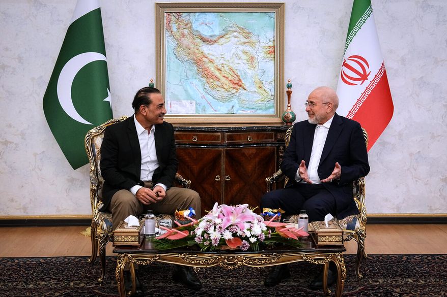 In this photo released by the Islamic Consultative Assembly News Agency, ICANA, Iran's Parliament Speaker and top negotiator Mohammad Bagher Qalibaf, right, speaks with Pakistan's Army Chief Field Marshal Gen. Asim Munir during their meeting in Tehran, Iran, Monday, Aug. 24, 2026. (Mahmoud Hosseini/ICANA via AP) ** FILE **