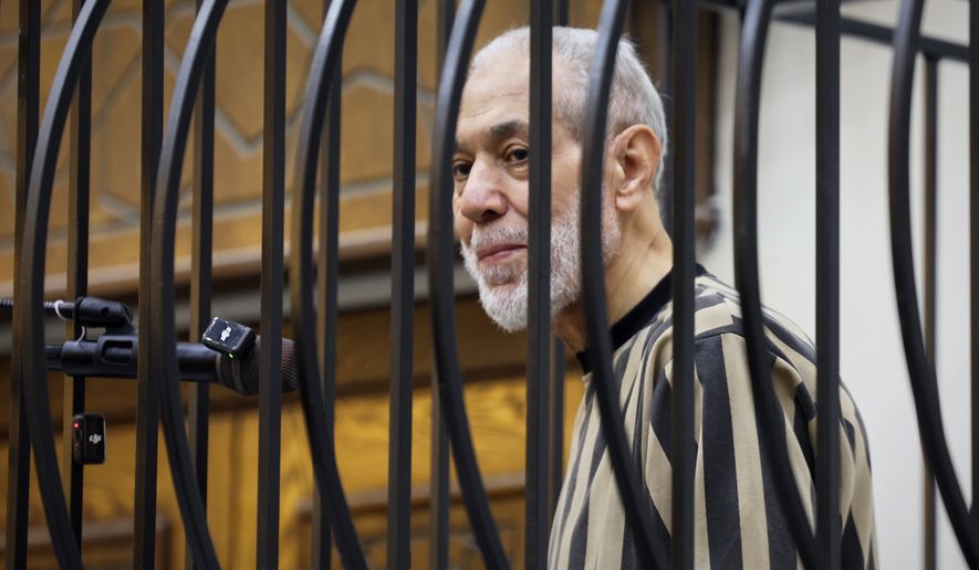 Syria's former grand mufti under ousted President Bashar Assad, Ahmad Badreddine Hassoun, stands as a court sentences him to life in prison at the Palace of Justice in Damascus, Syria, Monday, Aug. 24, 2026. (AP Photo/Ghaith Alsayed)