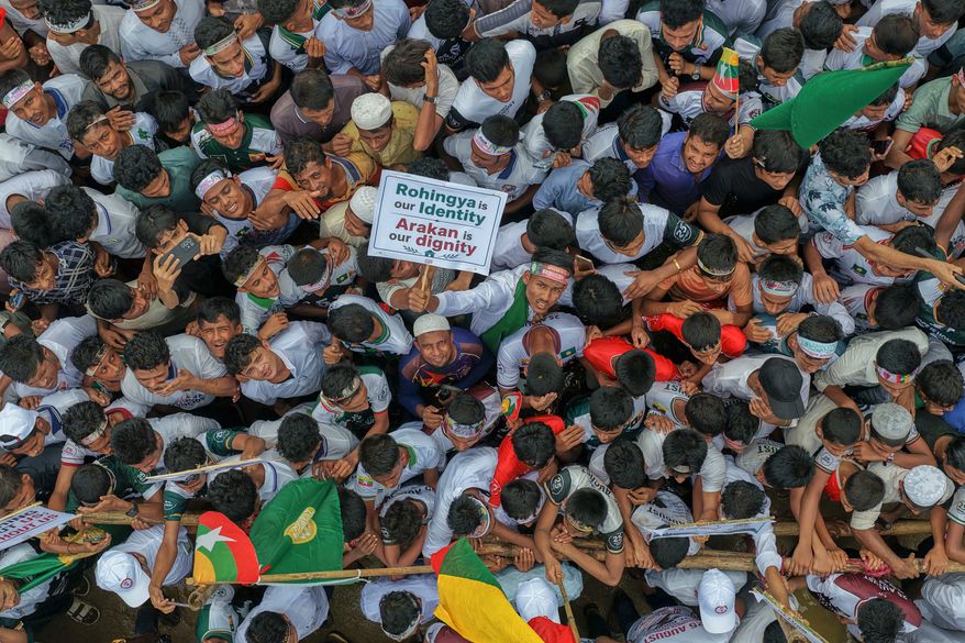 Rohingyas gather during an event at a refugee camp in Cox's Bazar, Bangladesh, Tuesday, Aug. 25, 2026, marking the anniversary of the their exodus. (AP Photo/Abdul Goni)
