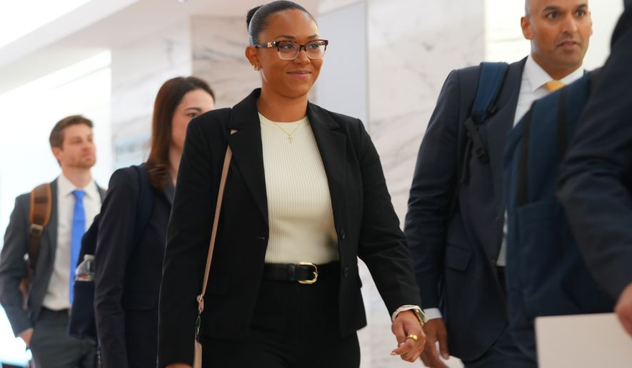 McKenna West, left, arrivers with her legal team for a court hearing in Dallas, Tuesday, Aug. 25, 2026. (AP Photo/LM Otero)