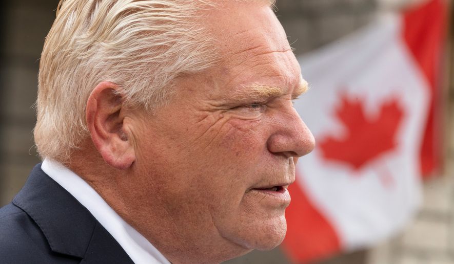 Ontario Premier Doug Ford speaks to media at a housing development in Hamilton, on Monday, Aug. 24, 2026. (Nick Iwanyshyn/The Canadian Press via AP)