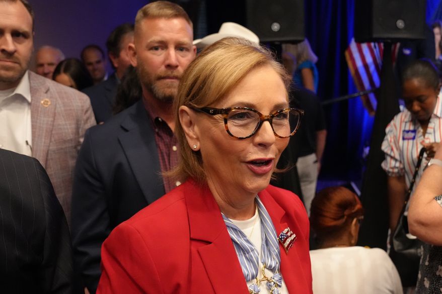 Sen. Darline Graham, R-S.C., heads out into the crowd after winning a special Republican primary runoff to replace her brother, the Sen. Lindsey Graham, R-S.C., in the November general election, Tuesday, Aug. 25, 2026, in Columbia, S.C. (AP Photo/Meg Kinnard) ** FILE **