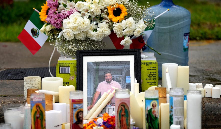 A memorial grows at the site where Lorenzo Salgado Araujo was fatally shot by ICE agents, last week, on Monday, July 13, 2026, in Houston. (AP Photo/Karen Warren, File)