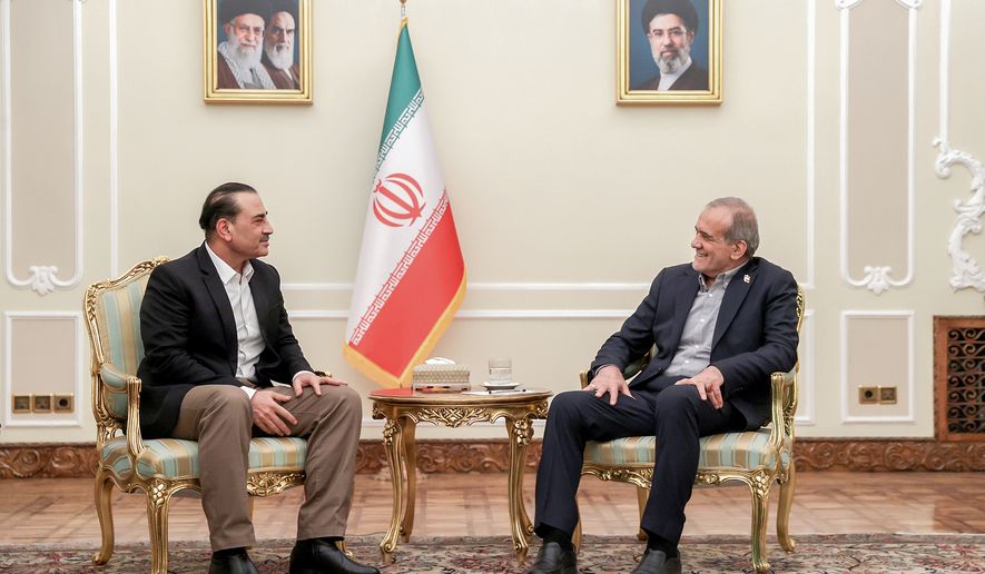 In this photo released by the Iranian Presidency Office, President Masoud Pezeshkian, right, meets Pakistan's Army Chief Field Marshal Gen. Asim Munir in Tehran, Iran, Monday, Aug. 24, 2026. (Iranian Presidency Office via AP)