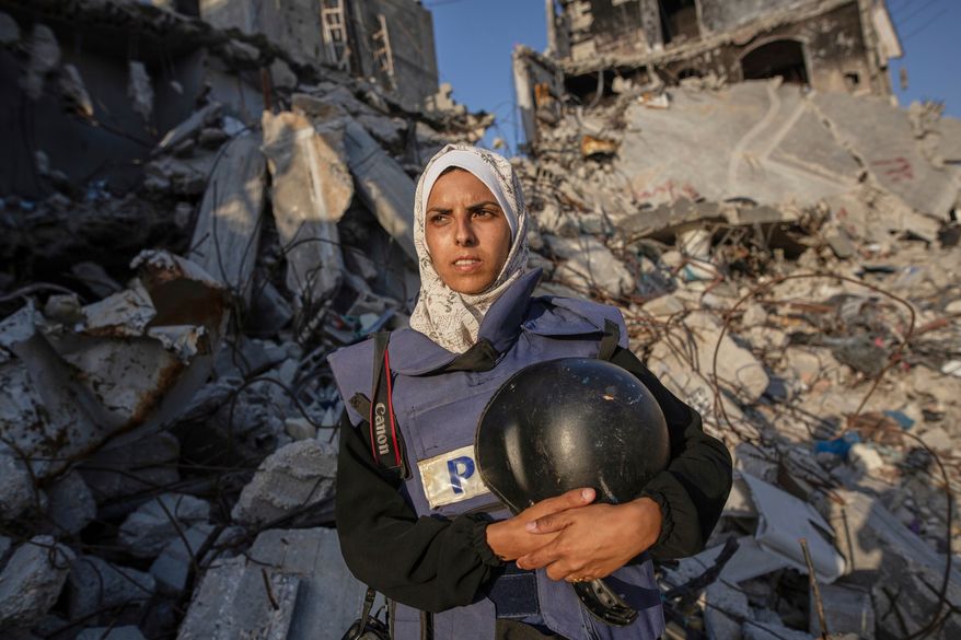 FILE - Freelance journalist Mariam Dagga, 33, who had been working with the Associated Press and other outlets during the Gaza war, poses for a portrait in Khan Younis, southern Gaza Strip, on June 14, 2024. (AP Photo/Jehad Alshrafi, File)