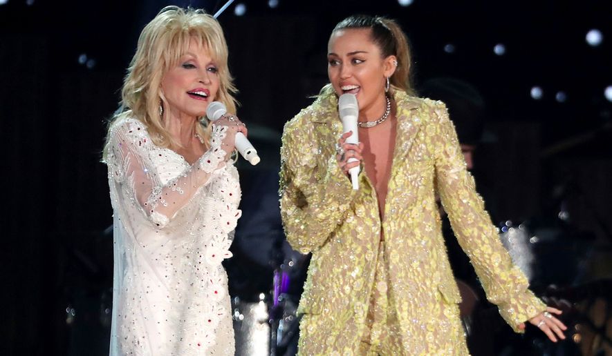Dolly Parton, left, and Miley Cyrus perform "Jolene" at the 61st annual Grammy Awards in Los Angeles on Feb. 10, 2019. (Photo by Matt Sayles/Invision/AP, File)
