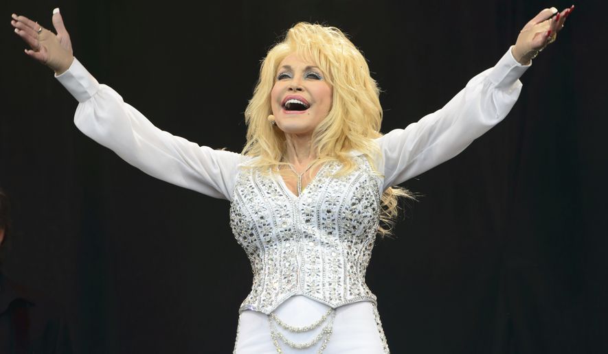 Dolly Parton performs at Glastonbury music festival, June 29, 2014. (Photo by Jonathan Short/Invision/AP, File)