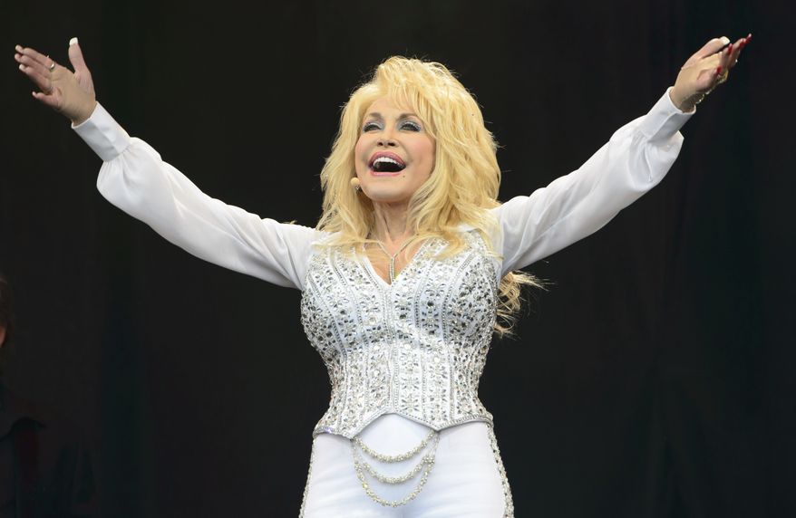 Dolly Parton performs at Glastonbury music festival, June 29, 2014. (Photo by Jonathan Short/Invision/AP, File)