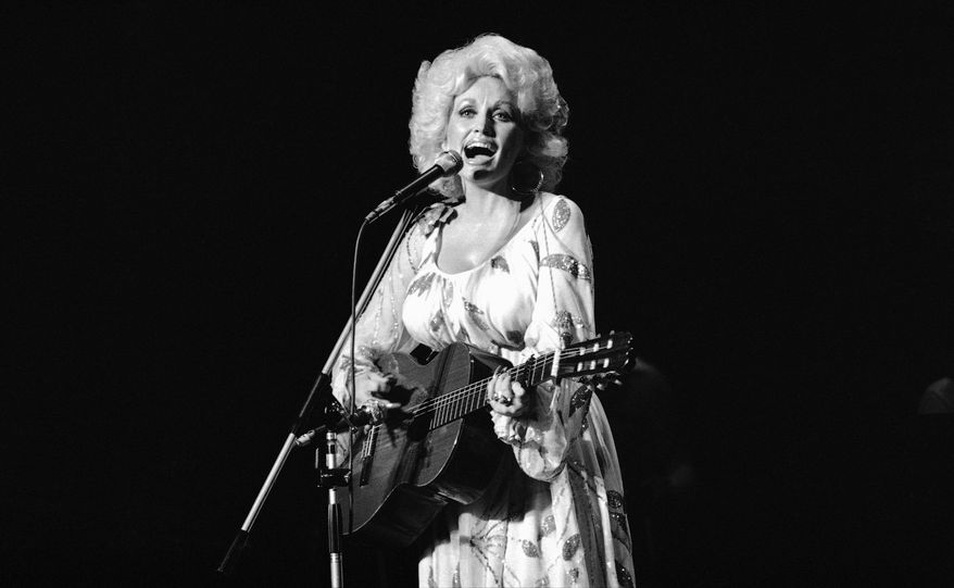Dolly Parton performs in concert in Tokyo, July 30, 1979. (AP Photo/Tsugufumi Matsumoto) **FILE**