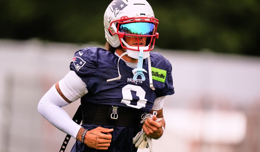 New England Patriots cornerback Christian Gonzalez runs to the practice field during the team's NFL football training camp, Thursday, July 30, 2026, in Foxborough, Mass. (AP Photo/Charles Krupa)