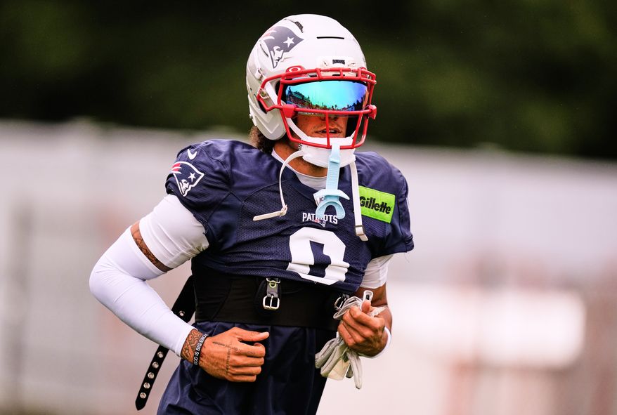 New England Patriots cornerback Christian Gonzalez runs to the practice field during the team's NFL football training camp, Thursday, July 30, 2026, in Foxborough, Mass. (AP Photo/Charles Krupa)