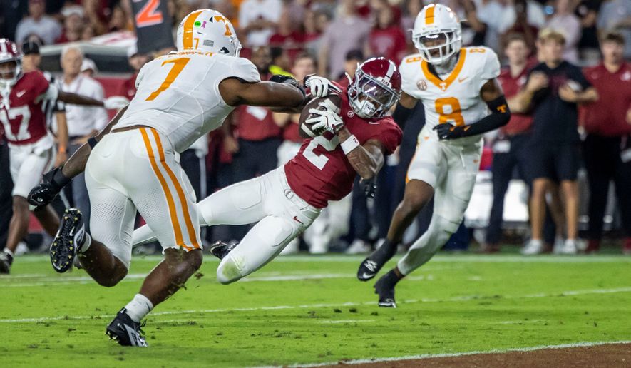 FILE - Alabama wide receiver Ryan Williams (2) grabs a pass in front of Tennessee linebacker Arion Carter (7) during the first half of an NCAA college football game, Oct. 18, 2025, in Tuscaloosa, Ala. (AP Photo/Vasha Hunt, File)