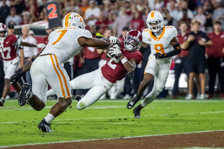 FILE - Alabama wide receiver Ryan Williams (2) grabs a pass in front of Tennessee linebacker Arion Carter (7) during the first half of an NCAA college football game, Oct. 18, 2025, in Tuscaloosa, Ala. (AP Photo/Vasha Hunt, File)