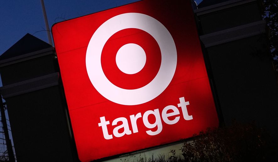 The Target logo displayed on a sign outside a store, Nov. 18, 2025, in Salem, N.H. (AP Photo/Charles Krupa, File)