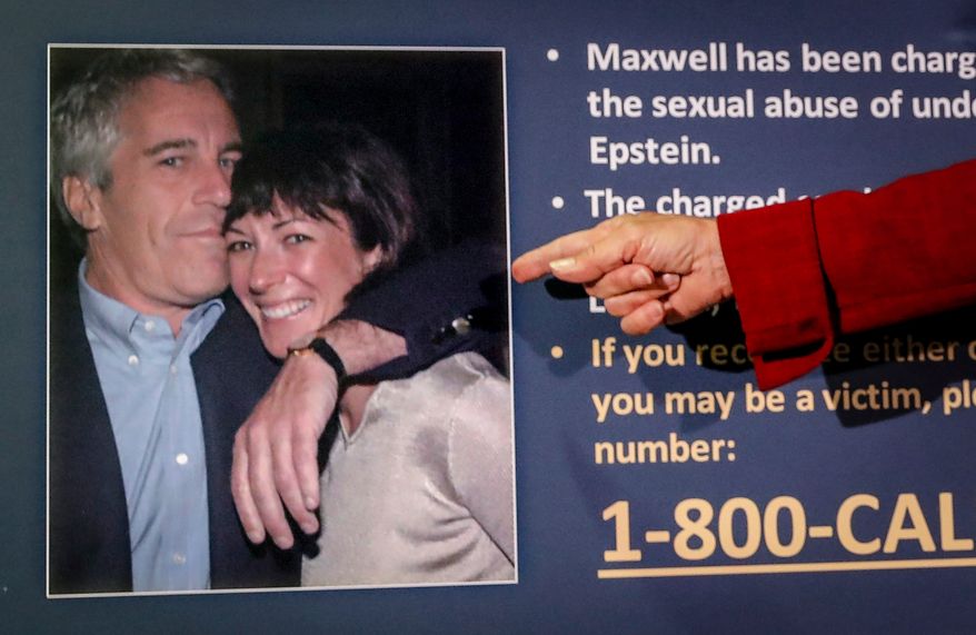 Audrey Strauss, acting U.S. attorney for the Southern District of New York, points to a photo of Jeffrey Epstein and Ghislaine Maxwell during a news conference in New York on July 2, 2020. (AP Photo/John Minchillo, File)