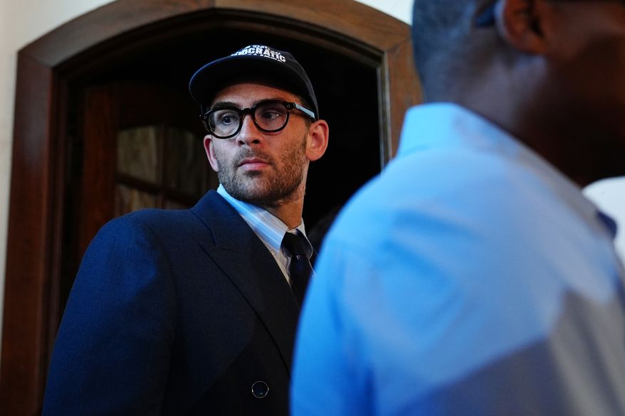 Streamer Hasan Pike listens as Abdul El-Sayed, a progressive candidate in the Democratic primary for U.S. Senate in Michigan, speaks at a campaign rally, Monday, Aug. 3, 2026, in Detroit. (AP Photo/Julia Demaree Nikhinson)