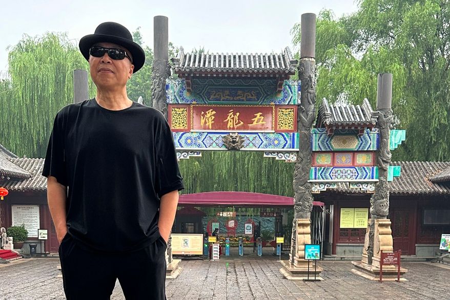 In this photo taken June 2023 and released by Zhao Yaliang, Chinese artist Gao Zhen poses for a photo in Jinan in northern China's Shandong province. (Zhao Yaliang via AP)