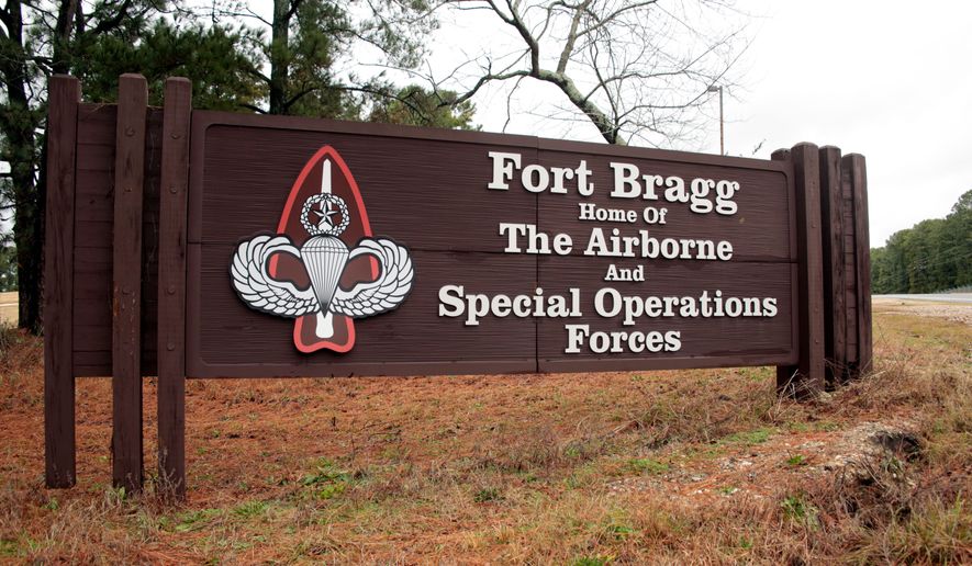 FILE - A sign at Fort Bragg, N.C., is seen, Jan. 4, 2020. (AP Photo/Chris Seward, File)