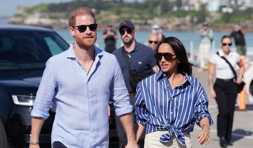 Prince Harry, and Meghan, the Duke and Duchess of Sussex, arrive for an event, during a visit to Bondi Beach, Australia, April 17, 2026. (Jonathan Brady/Pool Photo via AP, File)