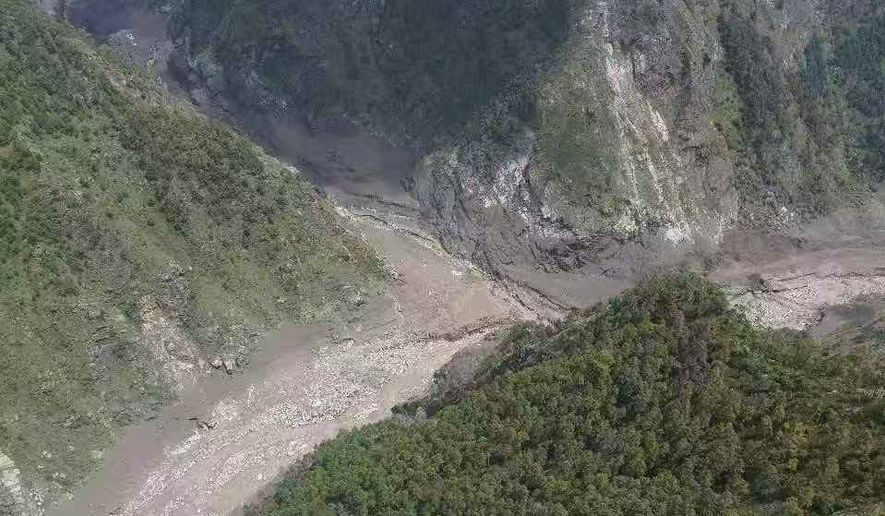 This photo released by Xinhua News Agency, shows a mudslide-hit area near Gyirong Port in southwestern China's Tibetan Autonomous Region on Wednesday, Aug. 26, 2026. (Xinhua via AP)
