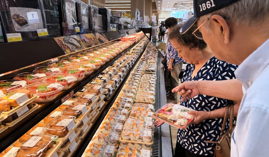 Customers shop at a grocery store in Arlington Heights, Ill., Monday, July 6, 2026. (AP Photo/Nam Y. Huh) ** FILE **