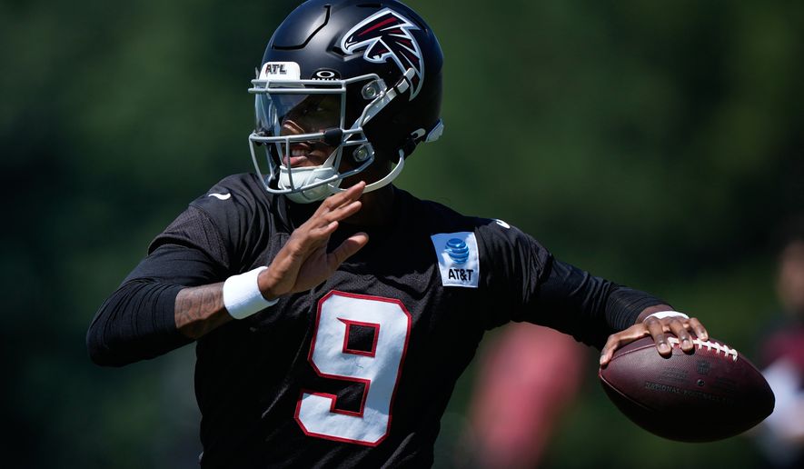 Atlanta Falcons quarterback Michael Penix Jr. (9) runs drills during an NFL football training camp practice Monday, Aug. 24, 2026, in Flowery Branch, Ga. (AP Photo/Brynn Anderson)