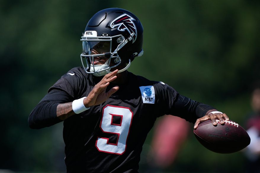Atlanta Falcons quarterback Michael Penix Jr. (9) runs drills during an NFL football training camp practice Monday, Aug. 24, 2026, in Flowery Branch, Ga. (AP Photo/Brynn Anderson)