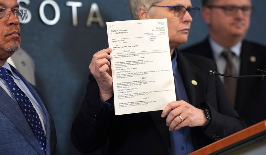 FILE - Hennepin County attorney Mary Moriarty holds up a document containing charges against ICE agent Christian Castro during a news conference at the Hennepin County Government Center in Minneapolis, on Monday, May 18, 2026. (Renée Jones Schneider/Minnesota Star Tribune via AP,File)