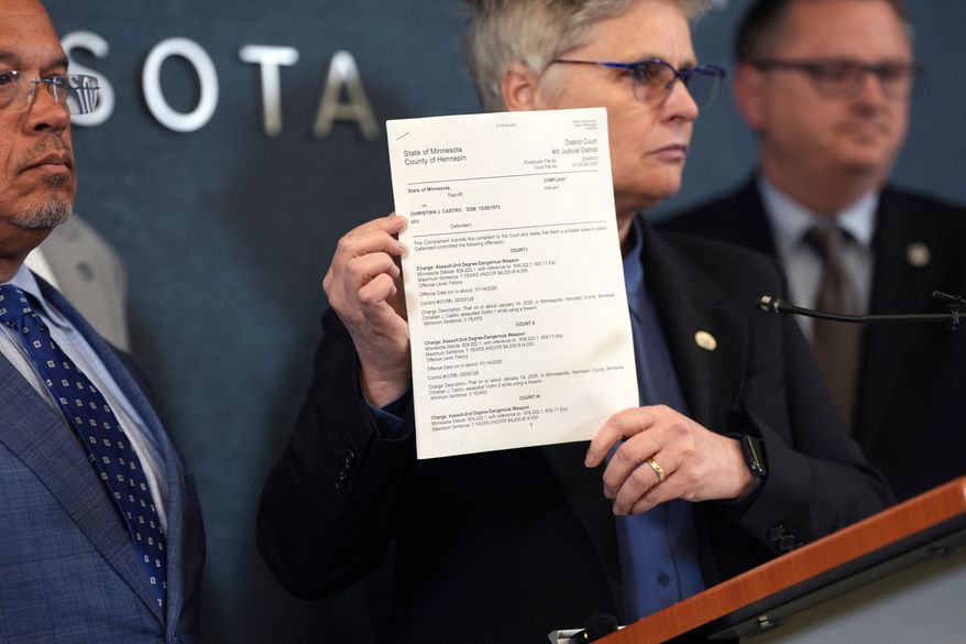 FILE - Hennepin County attorney Mary Moriarty holds up a document containing charges against ICE agent Christian Castro during a news conference at the Hennepin County Government Center in Minneapolis, on Monday, May 18, 2026. (Renée Jones Schneider/Minnesota Star Tribune via AP,File)