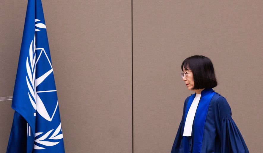 FILE - Judge Tomoko Akane walks before delivering the verdict in the Al Hassan case at the International Criminal Court in The Hague, Netherlands, Wednesday Nov. 20, 2024. (Eva Plevier/Pool Photo via AP, file)