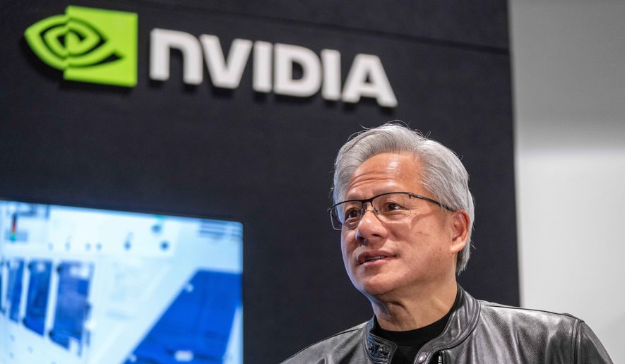Jensen Huang, president and CEO of Nvidia, waits for a groundbreaking ceremony for an expansion of Coherent's manufacturing facility to begin on June 16, 2026, in Sherman, Texas. (AP Photo/Jeffrey McWhorter, File)