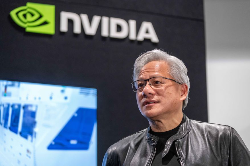 Jensen Huang, president and CEO of Nvidia, waits for a groundbreaking ceremony for an expansion of Coherent's manufacturing facility to begin on June 16, 2026, in Sherman, Texas. (AP Photo/Jeffrey McWhorter, File)