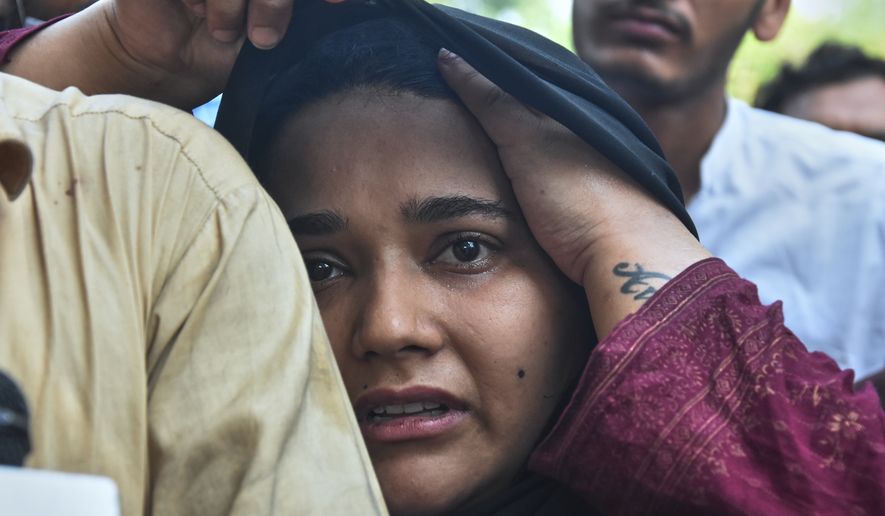 A woman, who lost her baby in a hospital fire, reacts at a hospital in Islamabad, Pakistan, Wednesday, Aug. 26, 2026. (AP Photo)