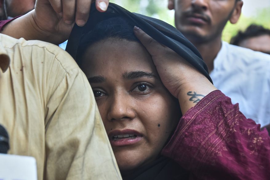 A woman, who lost her baby in a hospital fire, reacts at a hospital in Islamabad, Pakistan, Wednesday, Aug. 26, 2026. (AP Photo)
