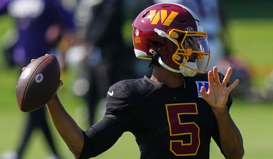 Washington Commanders quarterback Jayden Daniels (5) works out during the team's NFL football joint training camp with the Baltimore Ravens, Wednesday, Aug. 26, 2026, at the Under Armour Performance Center in Owings Mills, Md. (AP Photo/Stephanie Scarbrough)