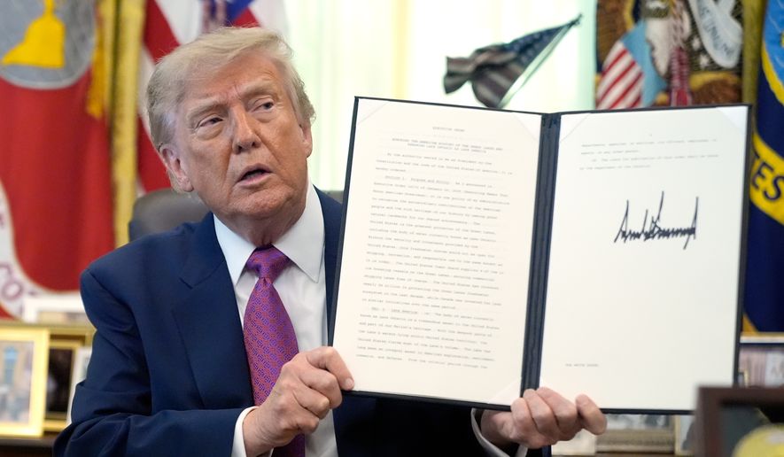 President Donald Trump holds up a signed executive order in the Oval Office of the White House, Thursday, Aug. 27, 2026, in Washington. (AP Photo/Manuel Balce Ceneta)