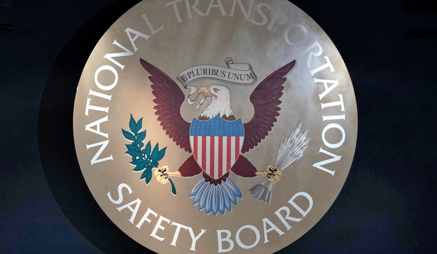 FILE - National Transportation Safety Board emblem is seen in the National Transportation and Safety Board boardroom in Washington, Jan. 27, 2026. (AP Photo/Jose Luis Magana, File)