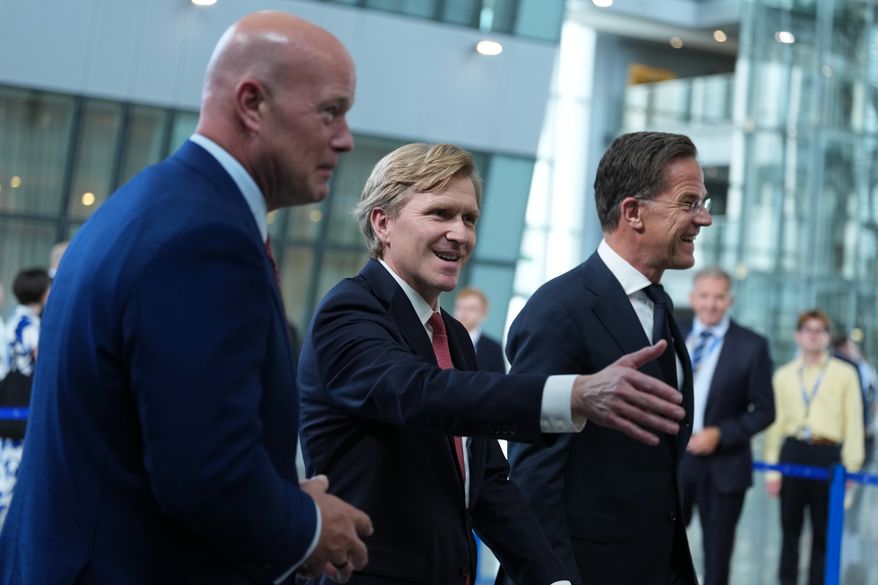From left, U.S. Ambassador to NATO Matthew Whitaker, U.S. Undersecretary of Defense Elbridge Colby and NATO Secretary General Mark Rutte walk together after addressing the media at NATO headquarters in Brussels, Thursday, Aug. 27, 2026. (AP Photo/Virginia Mayo)