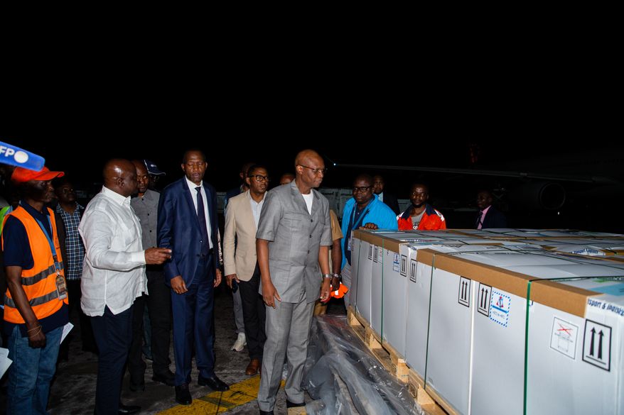 In this photo released by UNICEF, officials inspect doses of Ebola (Zaire) vaccines upon arrival at Ndjili International Airport in Kinshasa, Congo, Friday, Aug. 21, 2026. (Ndomba Mbikayi/UNICEF via AP)