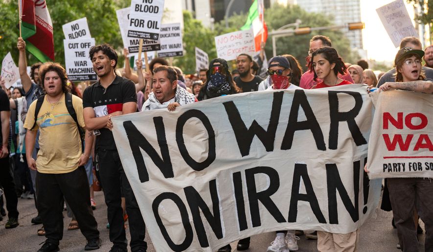 FILE - Protesters march in the streets of downtown Austin, Texas, to show opposition to the U.S.-Israeli war in Iran, during a demonstration organized by the Austin for Palestine Coalition, April 8, 2026. (Mikala Compton/Austin American-Statesman via AP, File)