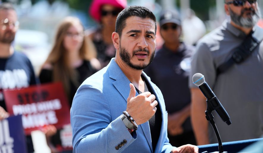 Democratic nominee for U.S. Senate Abdul El-Sayed speaks at a news conference at the base of the Spirit of Detroit monument in Detroit, Wednesday, Aug. 19, 2026. (AP Photo/Paul Sancya)
