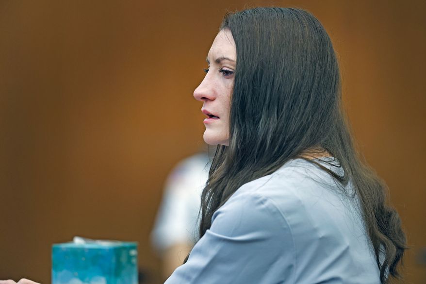 Lindsay Clancy tries to hold back tears as details of the murder of her three children are given in court during her murder trial at Plymouth Superior Court in Plymouth, Mass., Thursday, Aug. 27, 2026. (Greg Derr/The Patriot Ledger via AP, Pool)