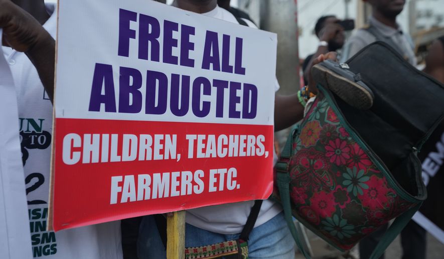 FILE - People protest demanding government to rescue the school children that were recently kidnapped in various part of the country, on the street of Lagos, Nigeria, Friday, June 12, 2026. (AP Photo/Sunday Alamba, File)