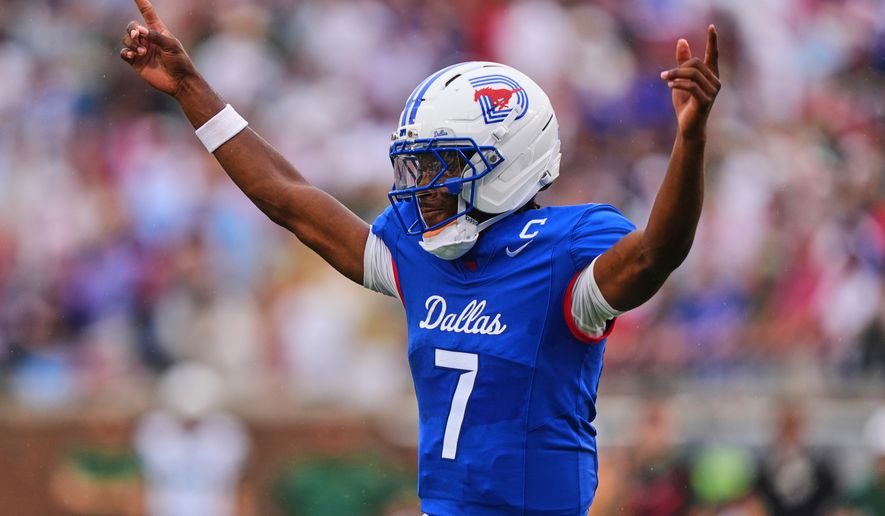FILE - SMU quarterback Kevin Jennings celebrates a touchdown during the first half of an NCAA college football game against Baylor, Sept. 6, 2025, in Dallas. (AP Photo/LM Otero, File)
